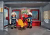 Two Playmobil firefighters in a control room setting. Produktbild-Vorschau