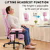 A woman is sitting in a pink office chair, demonstrating its adjustable headrest feature. Podgląd zdjęcia produktu