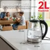 A family is sitting at a table in the background, while a glass electric kettle is in the foreground on a kitchen counter. Produktbild-Vorschau