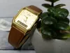 A gold Casio watch with a brown leather strap is placed next to a small potted plant. Anteprima dell’immagine prodotto