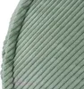 A close-up of green corduroy fabric. Náhľad obrázku produktu