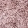 A close-up view of a shaggy, fluffy rug. Anteprima dell’immagine prodotto