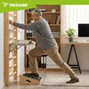 An older man is stretching on a slant board next to a wooden wall ladder in a home office setting. Náhľad obrázku produktu