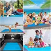 Collage of images showing a picnic blanket in various settings: outdoors with people and a dog, on a beach, in a car, and indoors with children. Produktbild-Vorschau