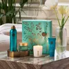 A collection of Rituals Karma products arranged on a marble table with flowers in a vase. Anteprima dell’immagine prodotto