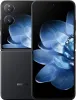 A black Xiaomi Mix Flip 5G smartphone is shown with its screen displaying a blue floral pattern. Náhled obrázku produktu