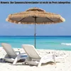 A beach scene with two lounge chairs and a thatched umbrella. Produktbild-Vorschau