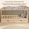 A wooden bed frame with drawers underneath, set in a child's bedroom with floral wallpaper. Produktbild-Vorschau