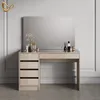A vanity table with a mirror and drawers, decorated with some cosmetic items and a vase of flowers. Voir les images du produit