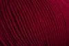 A close-up view of dark red yarn. Produktbild-Vorschau