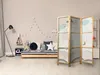 A child's bedroom with a bed, toys, and a room divider. Anteprima dell’immagine prodotto