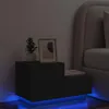 A black nightstand with LED lighting is placed next to a bed in a dimly lit room. Náhled obrázku produktu