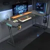 A gaming desk setup in a room with a computer, monitor, and accessories. Produktbild-Vorschau