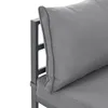 A close-up view of a grey outdoor sofa cushion and its metal frame. Produktbild-Vorschau