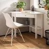 A white corner desk with a chair in a home office setting. Anteprima dell’immagine prodotto
