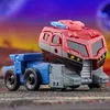 A toy robot in vehicle mode, resembling a fire truck, is shown from a side-angle on a textured surface with a colorful, abstract background. Anteprima dell’immagine prodotto