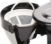 Close-up view of the filter basket and lid of a coffee maker. Produktbild-Vorschau