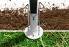 A close-up view of a pavilion base and ground stakes inserted into soil and grass. Produktbild-Vorschau