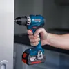 A hand holding a Bosch drill and drilling into a white surface. Voir les images du produit