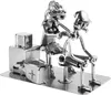 A metal sculpture of a tattoo artist and client. Podgląd zdjęcia produktu