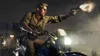 A man riding a motorcycle and firing a gun at night. Produktbild-Vorschau