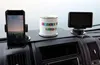 A dashboard of a vehicle with a phone mount, a mug, and a GPS device. Produktbild-Vorschau