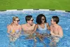 Four people are enjoying themselves in a round above-ground swimming pool. Produktbild-Vorschau