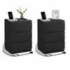 A pair of black nightstands with charging stations on top, shown against a white background. Náhled obrázku produktu