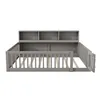 A grey wooden bed frame with a slatted base and a built-in bookshelf headboard, shown from the front with one side of the safety fence open. Produktbild-Vorschau