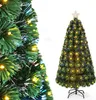 A close-up of a green artificial Christmas tree with fiber optic lights and a full shot of a similar tree with a star on top. Podgląd zdjęcia produktu