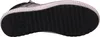 The image shows the sole of a black shoe with a white sole edge. Voir les images du produit