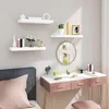 A bedroom scene with floating shelves and a vanity table. Produktbild-Vorschau