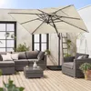 An outdoor patio scene with furniture and a large umbrella. Anteprima dell’immagine prodotto