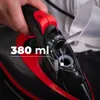 A hand is pouring water into a steam iron. Voir les images du produit