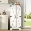 A white farmhouse-style storage cabinet with double doors is shown in a kitchen setting, next to a window with blinds. Anteprima dell’immagine prodotto