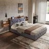 A bedroom scene with a bed, nightstands, and decor. Náhľad obrázku produktu