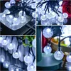 A collage of four images showing white LED string lights with bubble-like bulbs, some arranged on a reflective surface, others outdoors on a fence, and one close-up with a red rose in the background. Anteprima dell’immagine prodotto