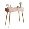 A pink console table with wooden legs, decorated with a lamp, candle, and flowers. Produktbild-Vorschau