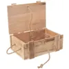 An open wooden box with rope handles and a rope attached to the lid. Produktbild-Vorschau