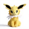 A yellow plush toy of a Pokémon character, likely Jolteon, is sitting and facing the camera against a white background. Produktbild-Vorschau