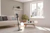 A modern living room with a sofa, coffee table, and a window overlooking a snowy landscape. Voir les images du produit