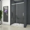 A modern bathroom with a sliding shower door, a towel rack with towels, and a plant. Produktbild-Vorschau