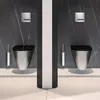 Two modern wall-mounted toilets with black seats are displayed side-by-side in a bathroom setting with dark marble walls and white platforms. Anteprima dell’immagine prodotto