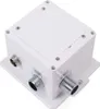 A white electronic device with metal connectors. Podgląd zdjęcia produktu