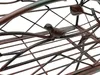 A close-up view of a decorative metal bird on a wire structure, likely part of a plant stand or garden ornament. Anteprima dell’immagine prodotto