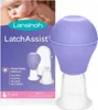 The image shows the packaging of a Lansinoh LatchAssist product, with a baby's face visible in the background and the product itself prominently displayed. Náhled obrázku produktu