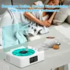 A person sleeping on a couch with a Bluetooth vinyl player and a cup of coffee on a table in the foreground. Produktbild-Vorschau