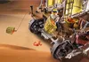 A Playmobil figure is operating a desert vehicle with a sail, collecting items in baskets. Anteprima dell’immagine prodotto