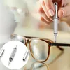 A hand is using a precision screwdriver to fix a pair of glasses. Produktbild-Vorschau
