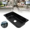 A collage showing a black RV sink in the foreground and the interior of an RV in the background. Podgląd zdjęcia produktu